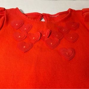 Vestido de niña color rojo con flores al delante